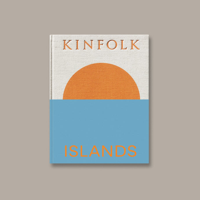 Kinfolk Islands by John Burns - An oatmeal, blue & vibrant orange textured hardback coffee table book with nature photography & inspiring travel itineraries.
