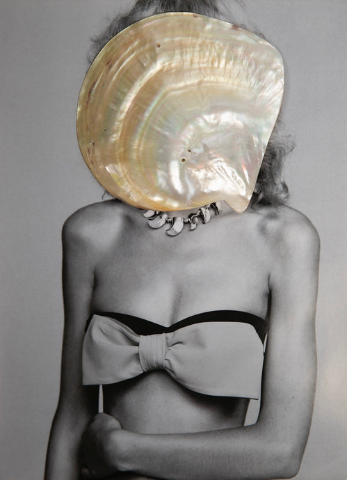 Mother of Pearl by Dina Broadhurst - A black and white photograph of a lady wearing bow bralette with a pearlescent shell covering her face.