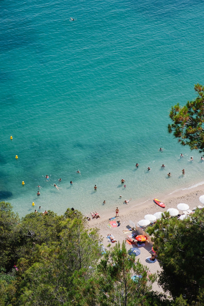 À La Plage by Via Tolila - A photographic print in blue and green tones overlooking a beach view in Villefranche sur Mer, France.