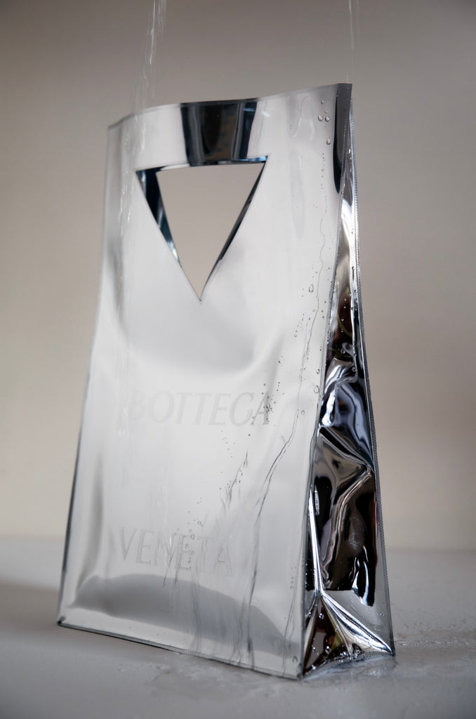 Bottega Drip by Dina Broadhurst - A fashion photograph of a chrome Bottega Veneta bag with water drip detail.