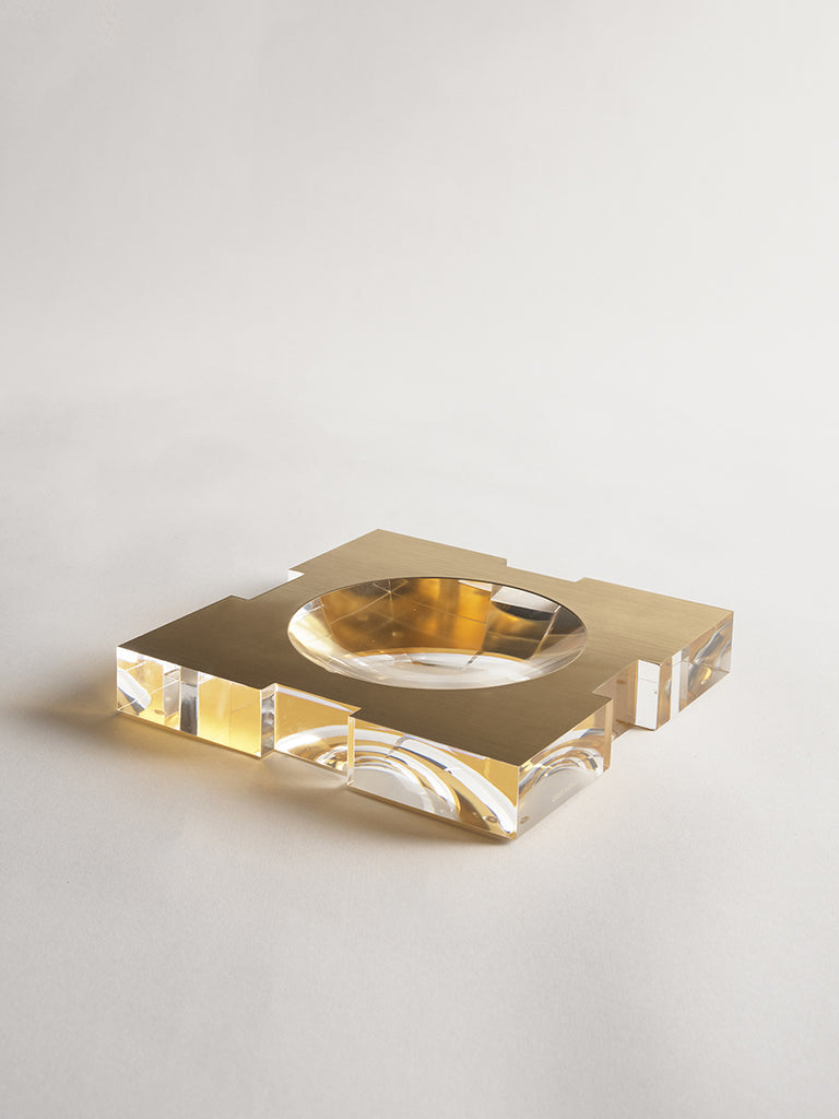 Carter Acrylic Bowl Brushed GOld Large by Greg Natale - Gold and clear acrylic ashtray style bowl on a light grey background.