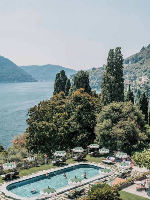 Como Dreaming by Stuart Cantor - A photographic print in blue and green tones overlooking a pool and lake view in Lake Como, Italy.