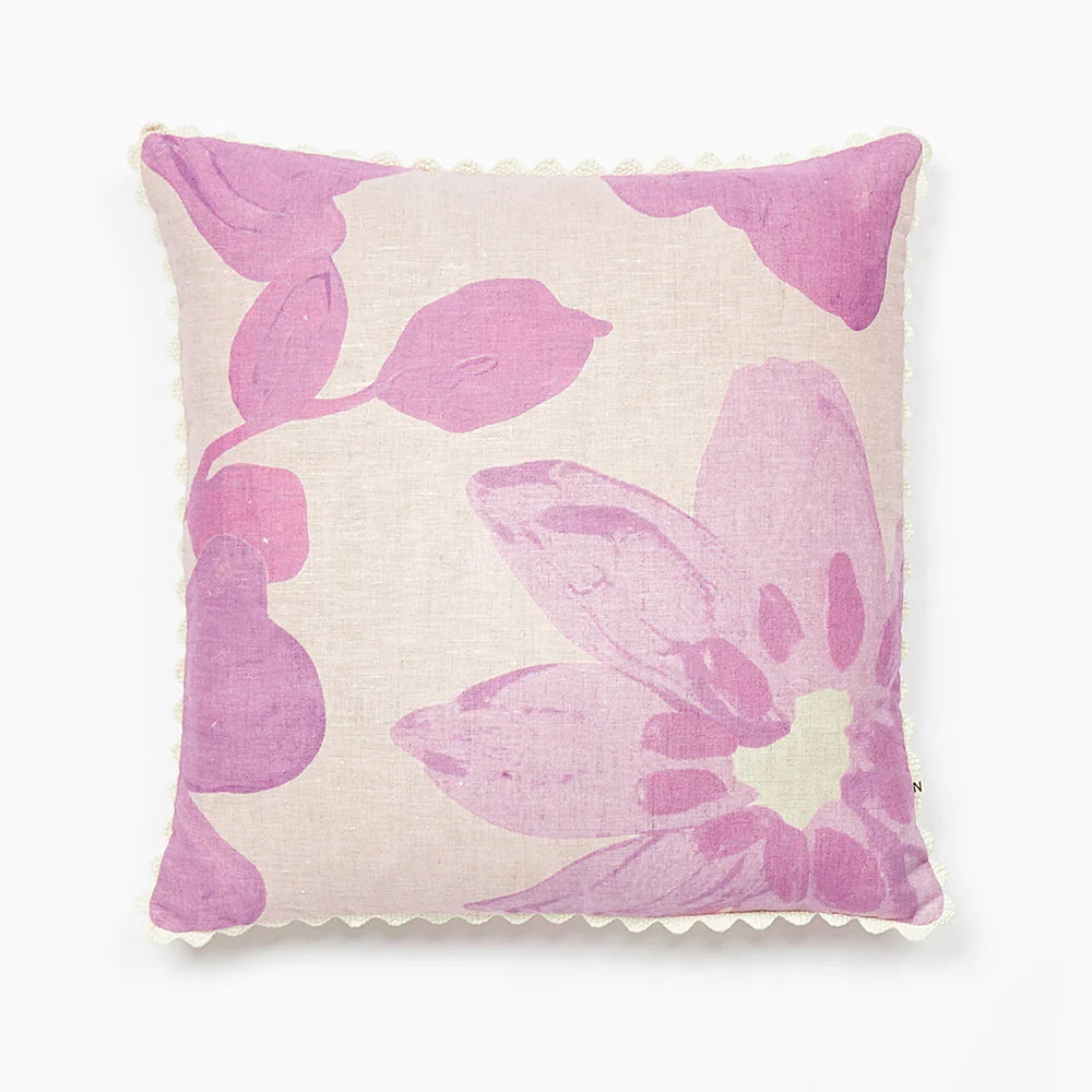 Dogwood Lilac 60cm Cushion - An image of a square linen cushion with a purple floral print and scalloped edges.