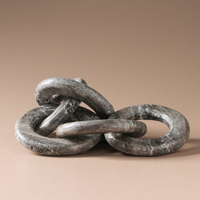 Hera Chain by Indigo Love Collectors - A grey marble chain link sculpture with white veining.