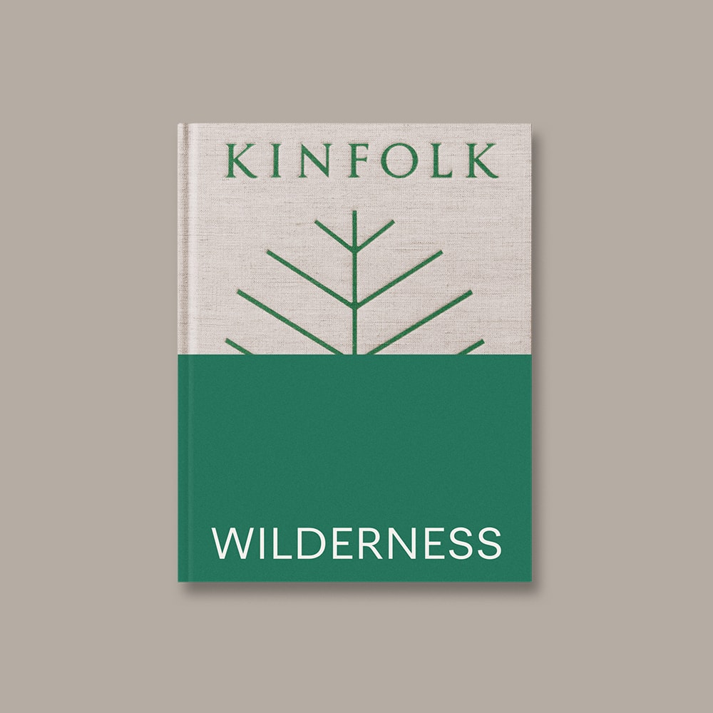Kinfolk Wilderness by John Burns - An oatmeal and green textured hardback coffee table book with nature photography & inspiring travel itineraries.