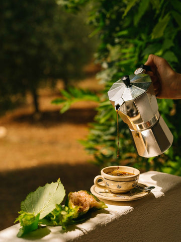 La Colazione, Puglia by Via Tolila - A warm, sun-filled photograph capturing a morning coffee moment.