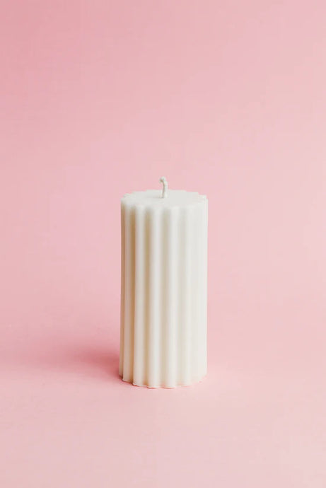 Mave Pillar Candle - White by Flört Designs - An image of a white ribbed candle.