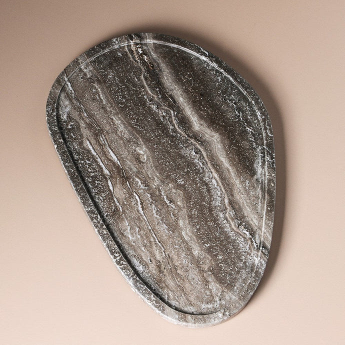 Moon Tray Grey Travertine by Indigo Love Collectors - An organic pebble-shaped natural stone tray, crafted in grey travertine with white veining.