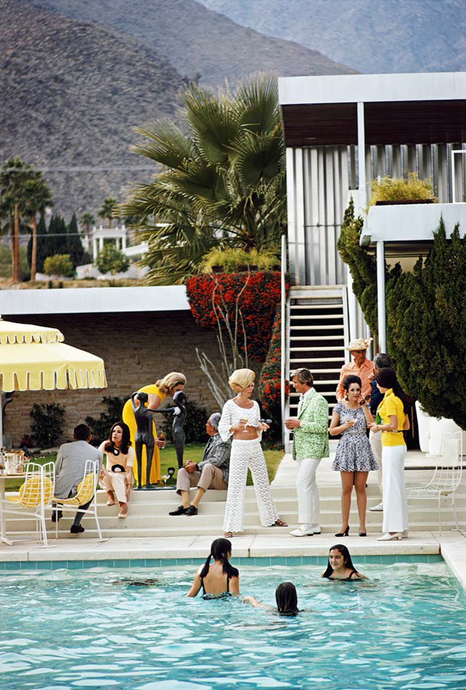 Party On The Steps by Slim Aarons - A vintage photograph of a poolside party in 1970