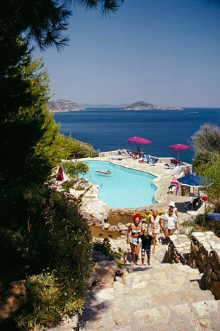 Pellicano Pool 2 by Slim Aarons - Pool view with the sea in the background