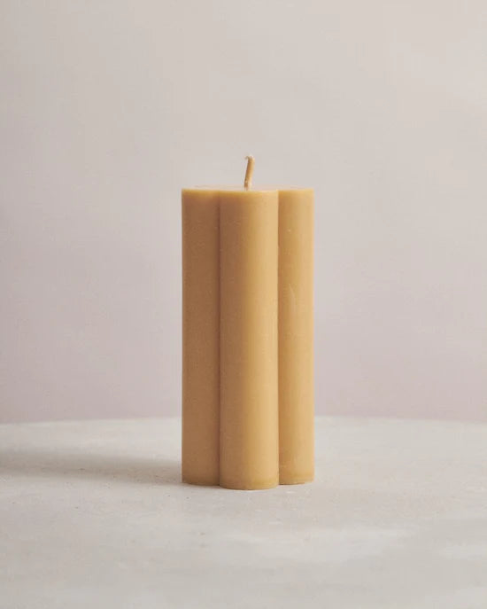 Poppy Floral Candle - Honey by Flört Designs - An image of a honey yellow coloured candle in the shape of a flower
