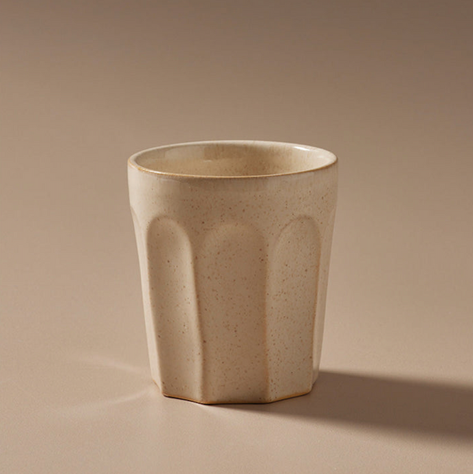 Ritual Latte Cup Off White by Indigo Love Collectors - A ceramic latte cup with a textural pattern in off white.