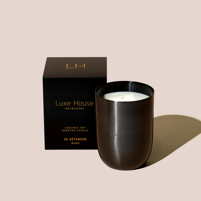 Se Détendre Black by Luxe House Melbourne - A vanilla and freesia scented candle in a black vessel with black packaging.