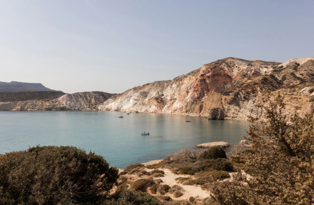 Signature Series - Mornings in Milos 01 by Francesca Owen - A serene image of small boats drifting in the still waters of Milos.