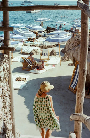 Steps to La Fontelina by Luke McCormick - A photographic print of beachgoers beneath umbrellas, captured in Italy.
