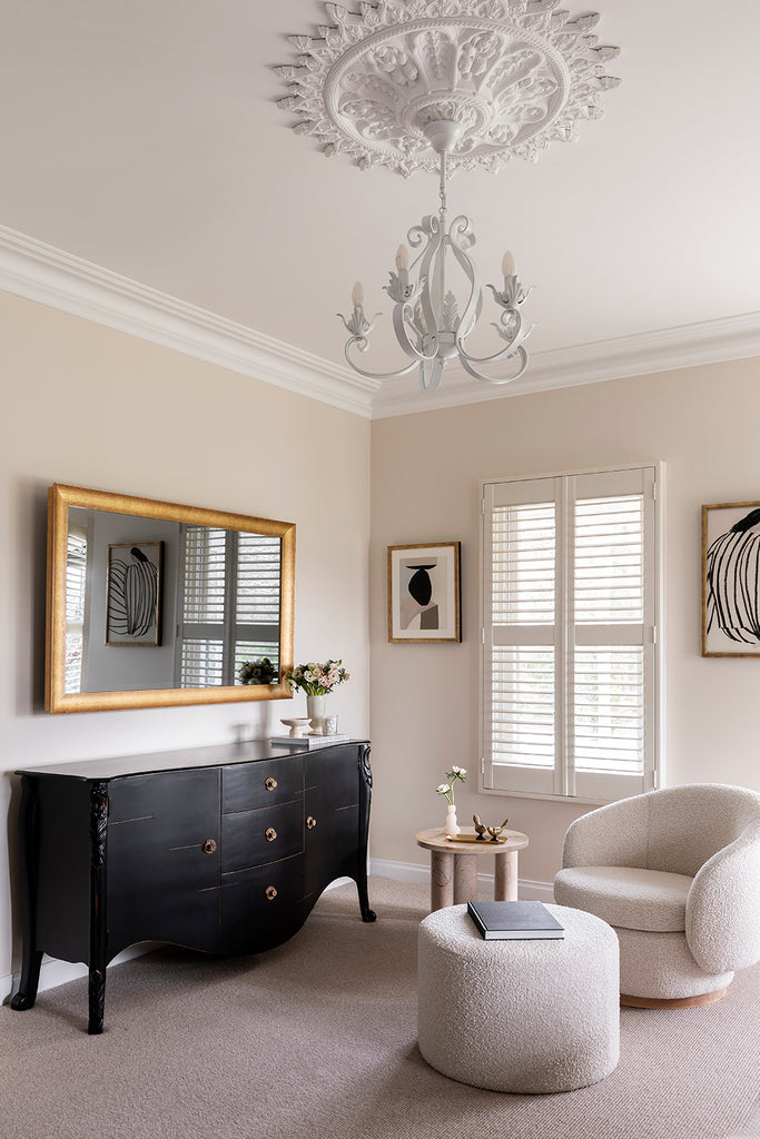 TV-Mirror with Gold Leaf Frame by FRAMING TO A T - A TV hidden behind a framed gold leaf mirror, styled in a formal lounge room.