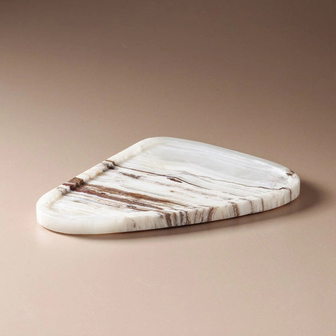 Uma Tray Multi Travertine - A natural stone travertine tray in organic curving pebble shape with warm brown vein detail.