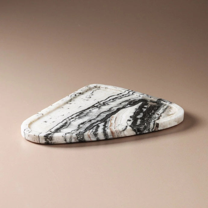 Uma Tray Onyx Travertine - A natural stone travertine tray in organic curving pebble shape with dramatic black vein detail.