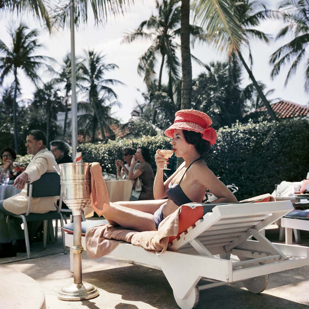 1970s photographic print of a stylish women lounging poolside