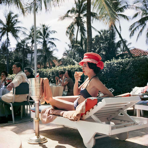 1970s photographic print of a stylish women lounging poolside