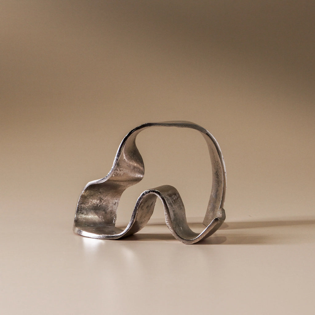 Ripple Sculpture by Indigo Love Collectors - a raw nickel abstract sculpture