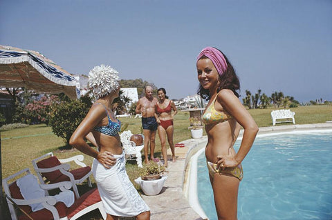 At The Von Pantzs by Slim Aarons - Bathers by the pool wearing fashionable vintage swimwear of the 1960s