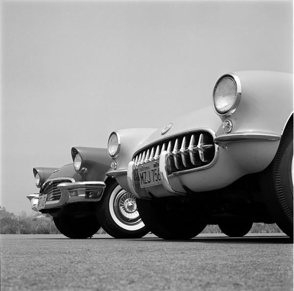 Chevrolet Corvette by Getty Images (UK) Ltd - A black and white close up photograph of two vintage cars.