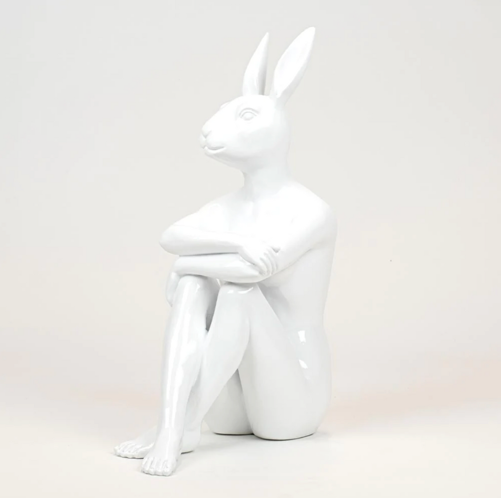 Cool City Bunny Sculpture by Gillie and Marc - A white sculpture of a rabbit with a female body sitting cross legged.
