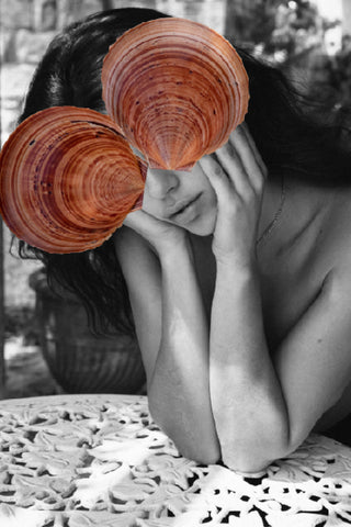 Call Out by Dina Broadhurst- A black and white portrait of a lady with rust coloured see shells collaged over her eyes.