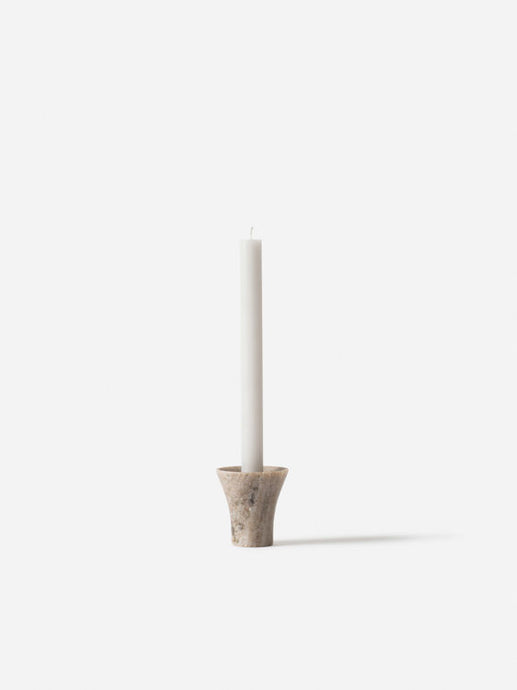 Flare Candle Holder Forest Brown by Città - a marbled beige candle holder with a tall white candle.