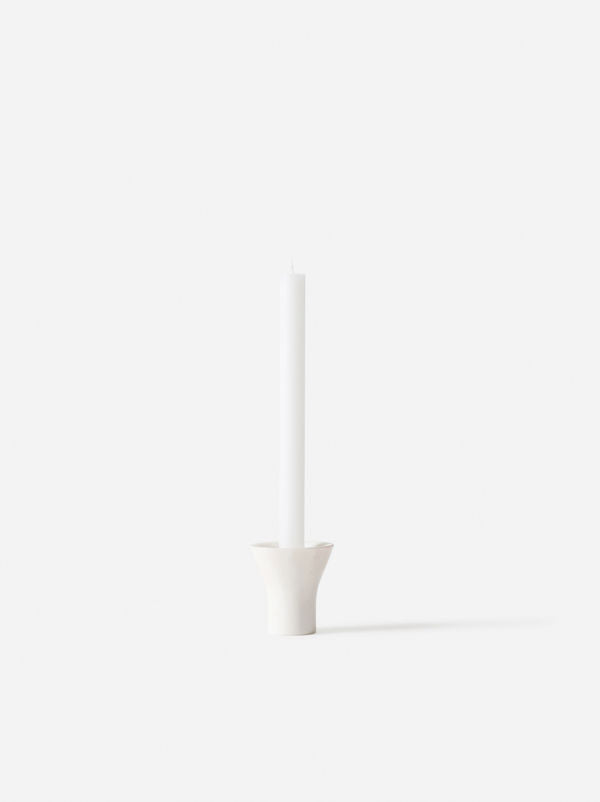 Flare Candle Holder White by Città - A marbled white candle holder with a tall white candle.
