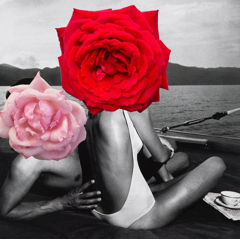 Holiday by Dina Broadhurst - A black and white photograph of a couple lounging on the beach with collages flowers overlaid, in true Dina Broadhurst style.