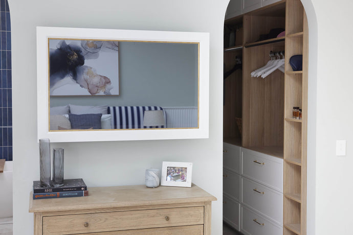 TV-Mirror Modern Matte White Frame with Beveled Edge & Gold Inner by FRAMING TO A T - A white frame with gold inner detail on a TV-Mirror in a Hamptons-inspired bedroom
