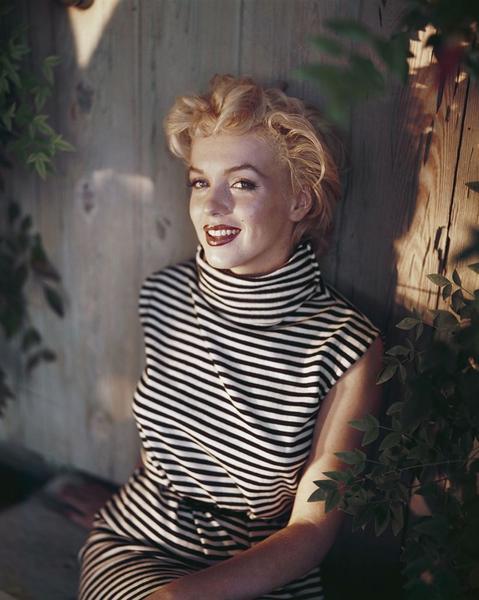 Marilyn Monroe by Getty Images (UK) Ltd - A candid photograph of Marilyn Monroe. She wears a black and white striped sleeveless dress with a high colour and red lipstick