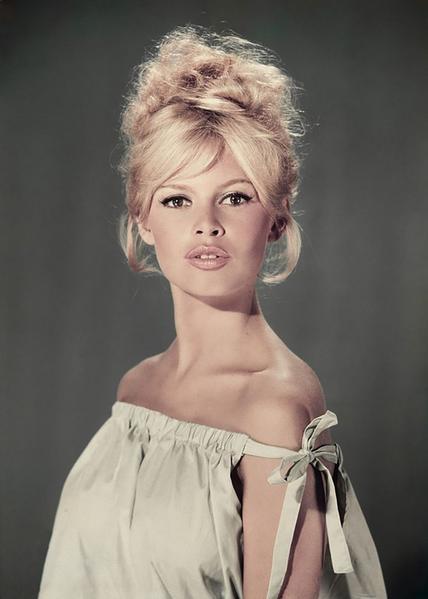 Pouting Bardot by Getty Images (UK) Ltd - A vintage studio portrait of actor and model Brigitte Bardot with pouted lips, wearing a light blue off-the-shoulder dress