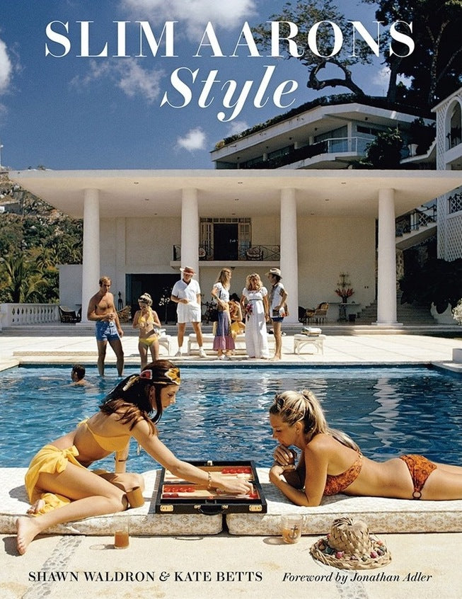 Slim Aarons Style by Slim Aarons, Shawn Waldron, Kate Betts, Getty Images (UK) Ltd - A vintage photograph of two women playing backgammon by the pool.