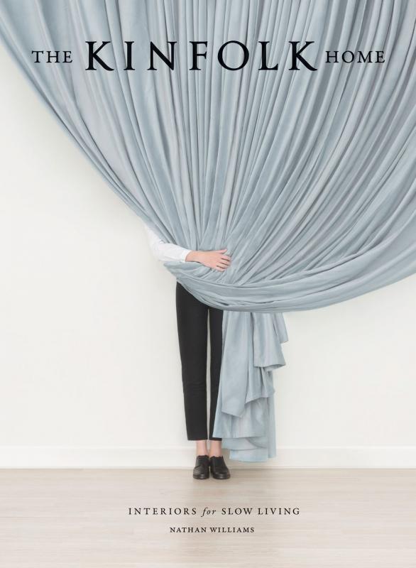 The Kinfolk Home by Nathan Williams - An artful image of a person obscured by a draping blue curtain.