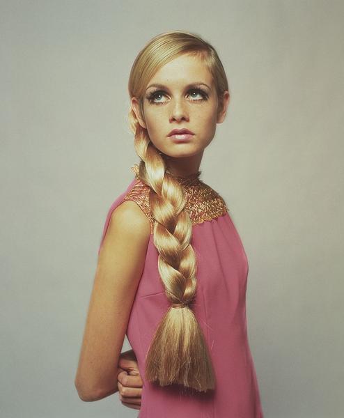 Twiggy in Pink by Getty Images (UK) Ltd - A vintage photograph of model Twiggy wearing a pink shift dress with a long, large plait