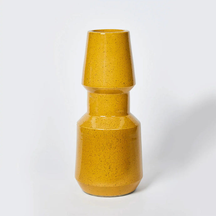 Earth Mustard Medium 35cm Vase - An irregularly shaped mustard vase with dark speckles.