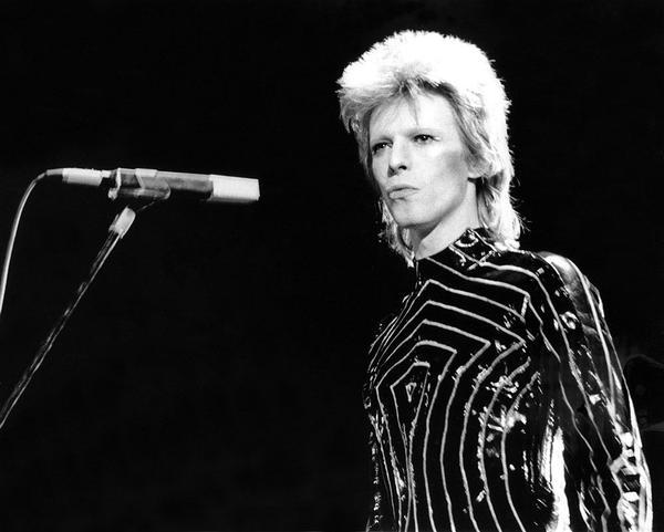 Ziggy Stardust Era Bowie In LA by Getty Images (UK) Ltd - A vintage black and white photograph of musician David Bowie performing onstage