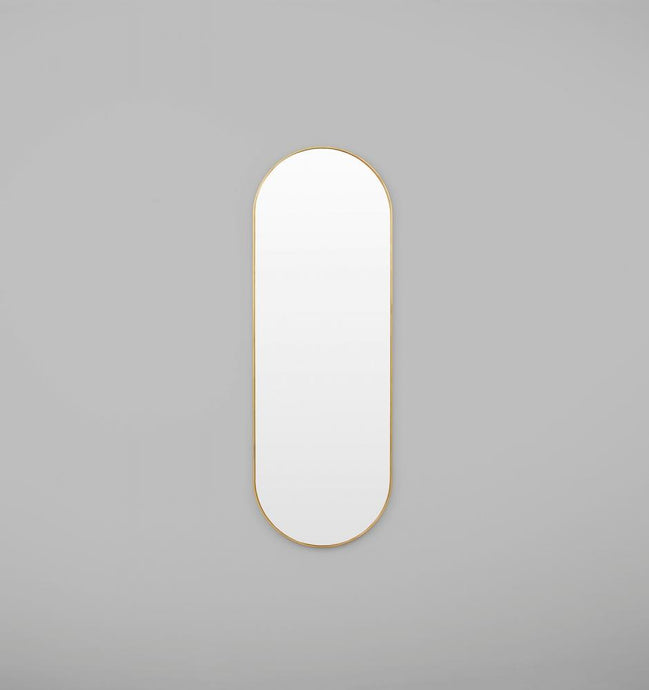 Bjorn Oval Large Brass Mirror by Middle of Nowhere. Streamline minimal design large oval mirror with brass gold leafed engineered wood frame to enhance any space.