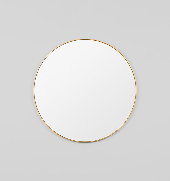 Bjorn Round Brass Mirror by Middle of Nowhere. Streamline minimal design round mirror with brass gold leaf engineered wood frame to enhance any space.