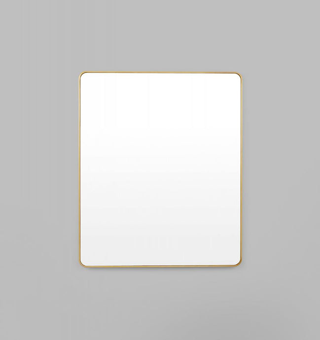 Flynn Curve Rectangle Brass Mirror by Middle of Nowhere. Streamline minimal design rectangle mirror with rounded edges in black engineered wood frame to enhance any space.